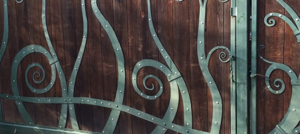 Ornamental Iron and Wood Driveway Gate
