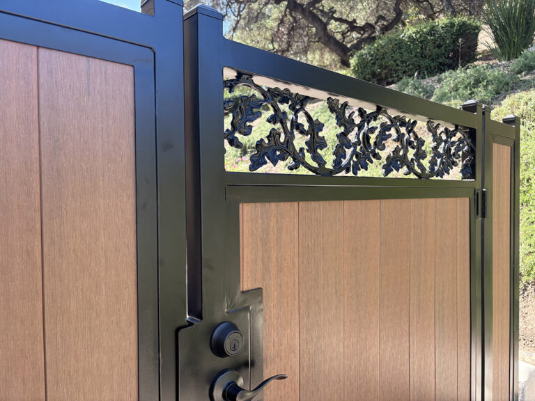 Close-up of a custom vinyl and wood horizontal inlay access gate