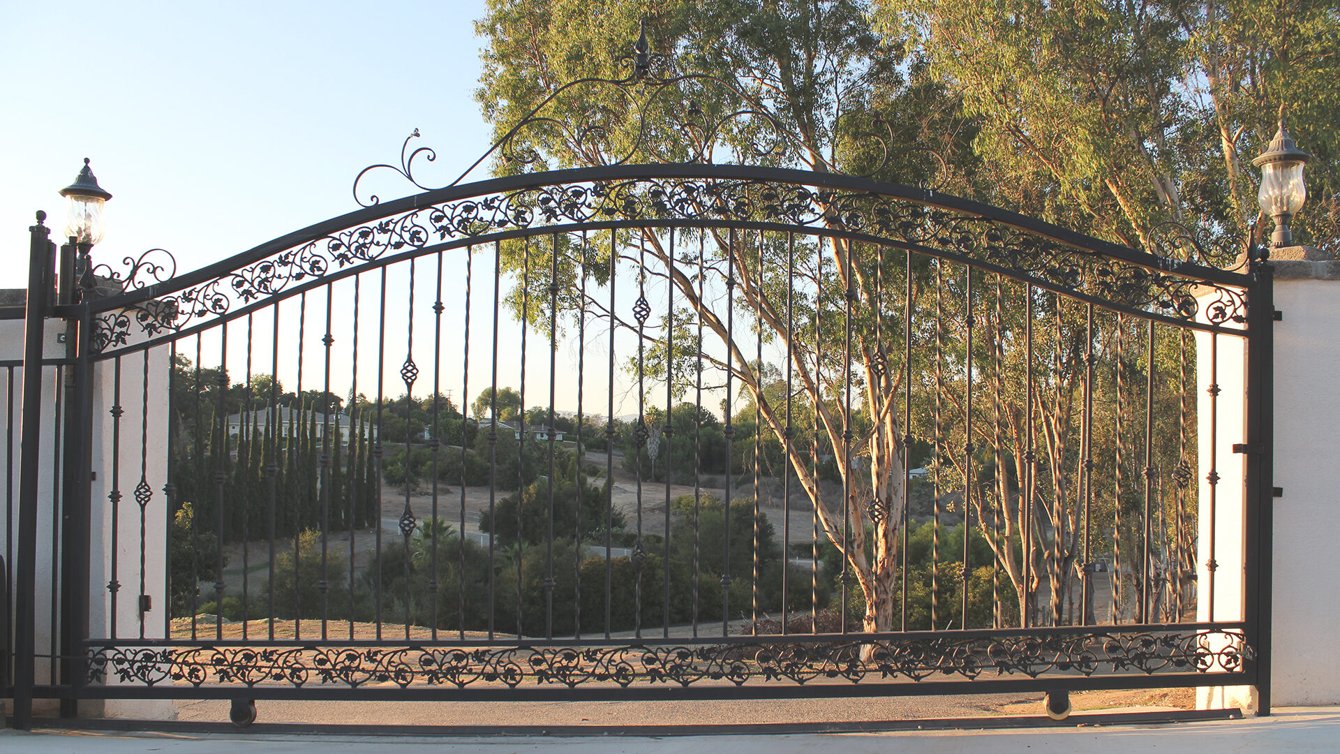 Custom wrought iron railing beside an exterior stairway