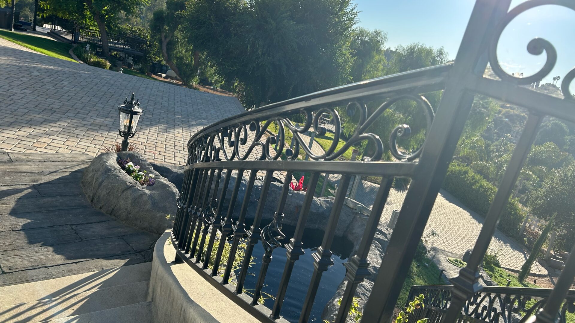 Ornamental iron hand railing at a residential property entrance