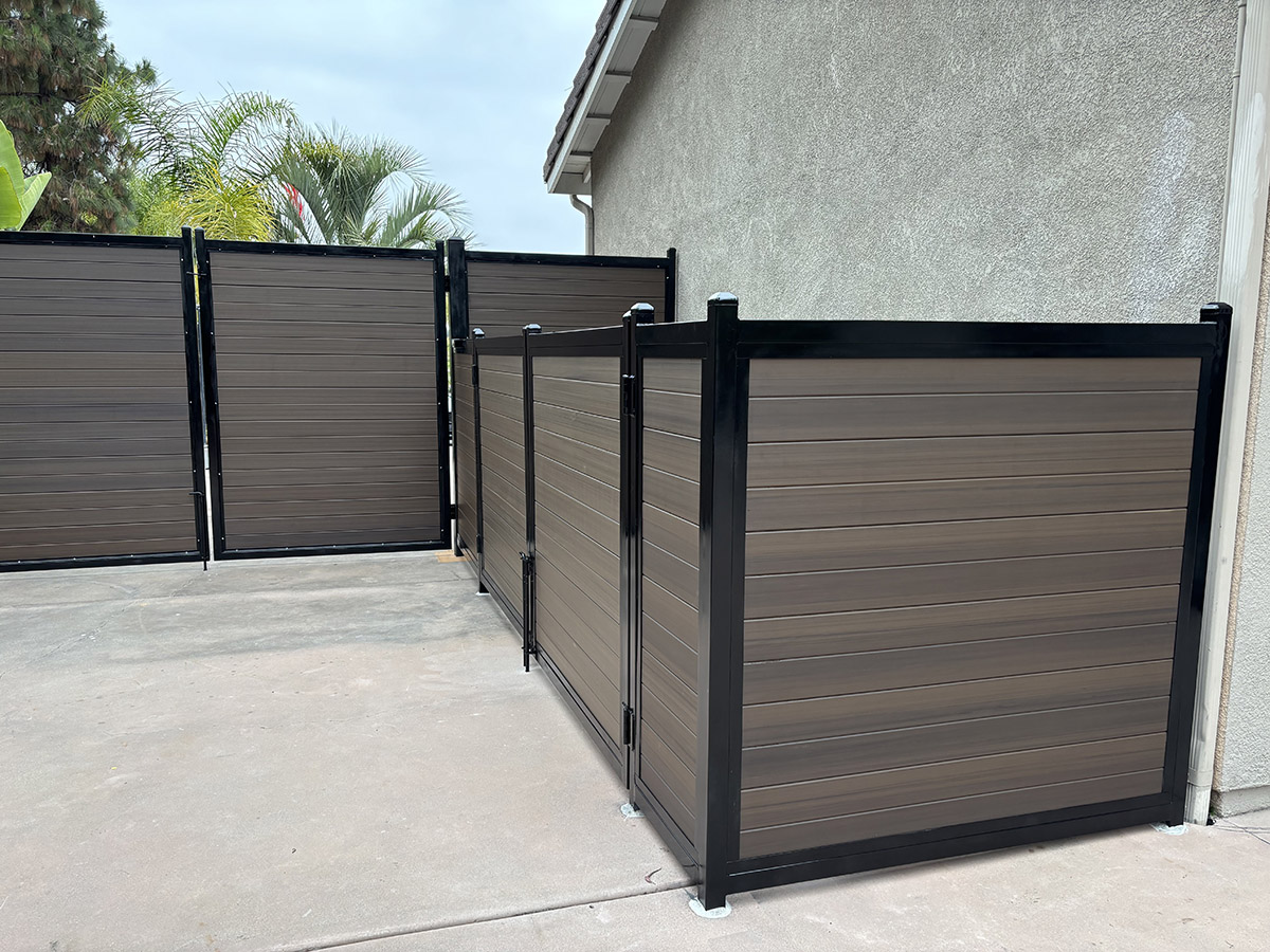 Custom wrought iron entry gate with security fencing