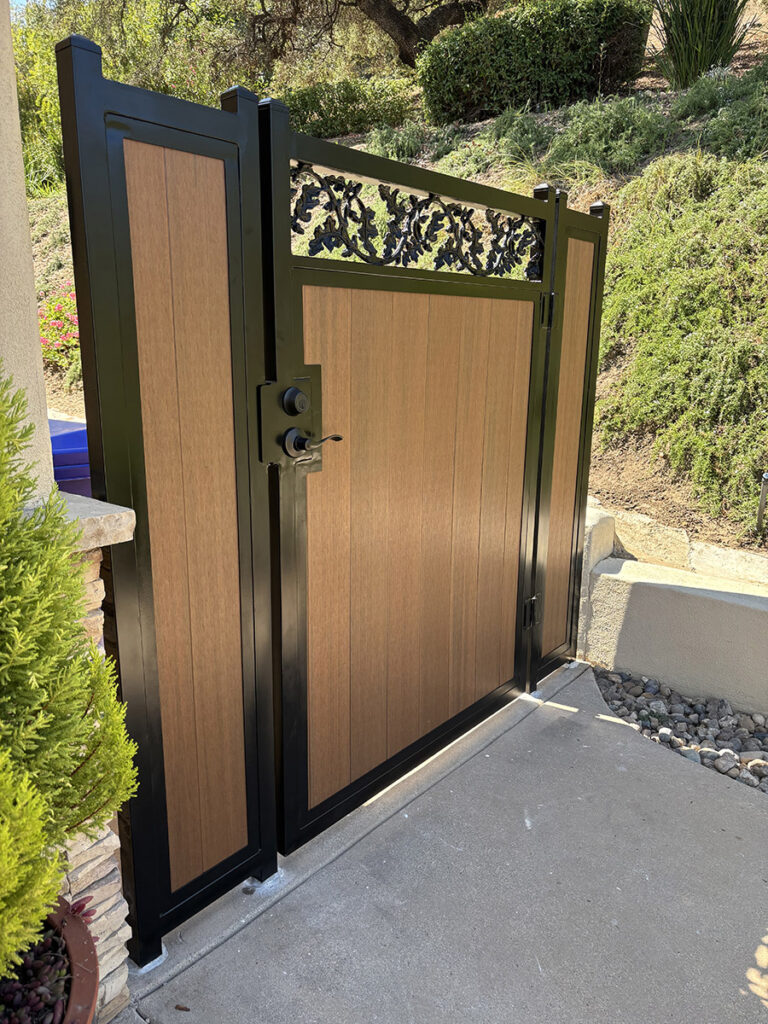 Vinyl and metal walkway gate at property entrance